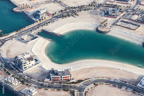 A bird's-eye view of the marina and the surrounding area reveals a carefully planned urban development, during building proccess photo