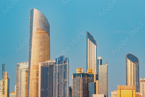 Marvel at the breathtaking beauty of Abu Dhabi s towering buildings at sunset  iconic skyline that s recognized around the world.