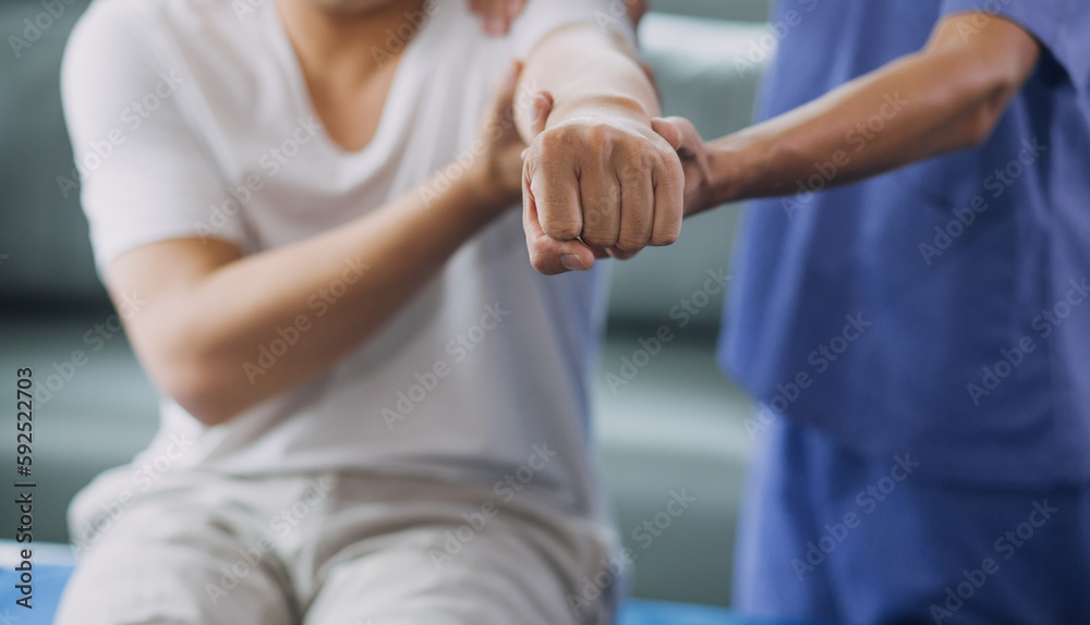 Physiotherapist working with patient in clinic, closeup Physiotherapist working with patient in clinic, closeup