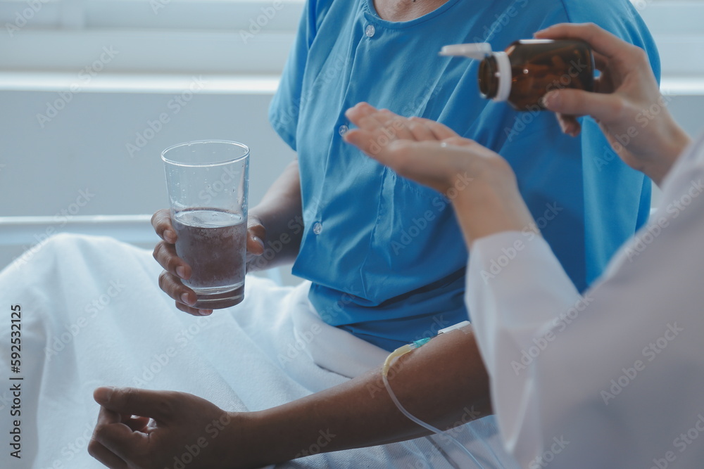 Injured patient showing doctor broken wrist and arm with bandage in hospital office or emergency room. Sprain, stress fracture or repetitive strain injury in hand. Nurse helping customer. First aid. Injured patient showing doctor broken wrist and arm with bandage in hospital office or emergency room. Sprain, stress fracture or repetitive strain injury in hand. Nurse helping customer. First aid.