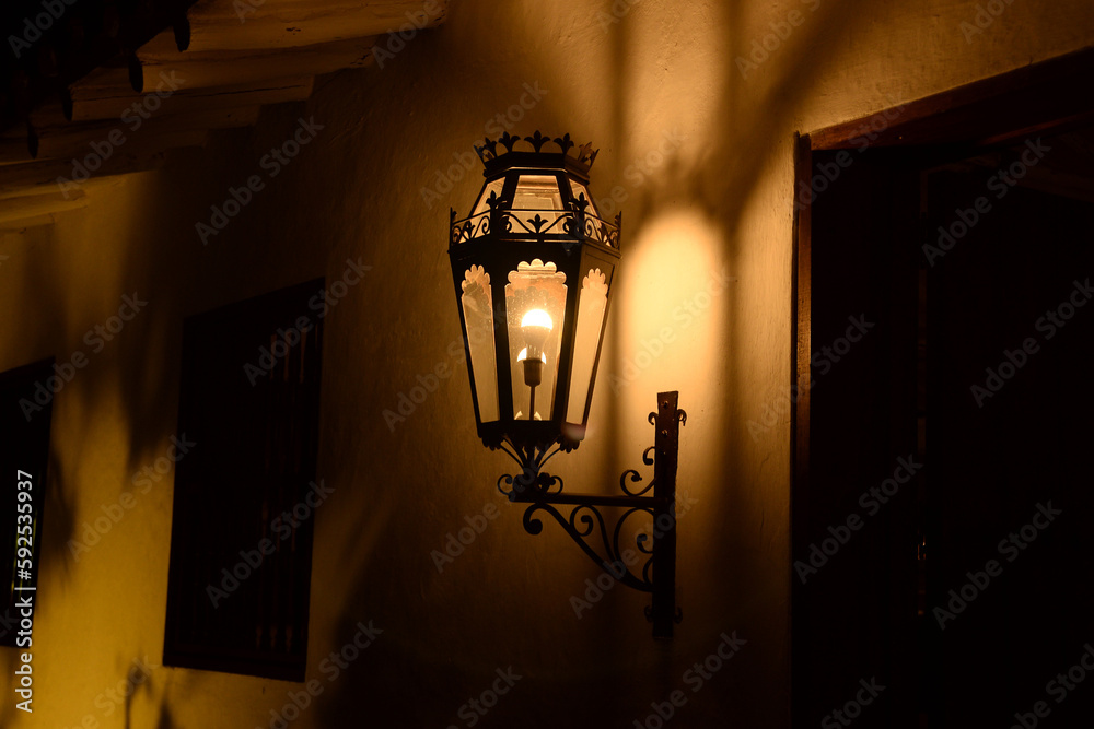 The lantern light illuminates the street on a romantic and bohemian night.