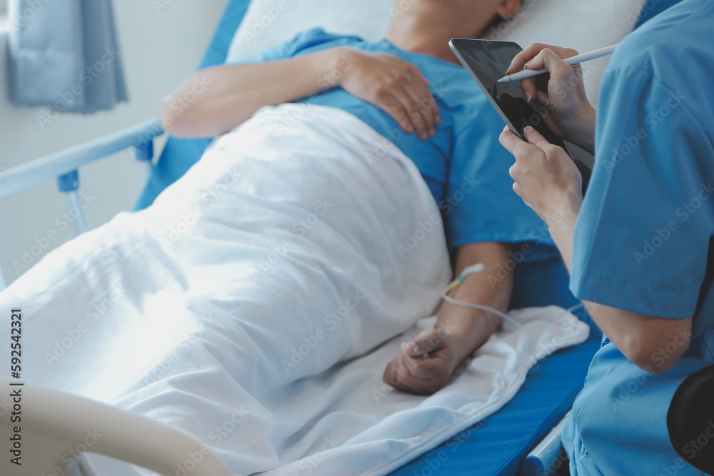 Injured patient showing doctor broken wrist and arm with bandage in hospital office or emergency room. Sprain, stress fracture or repetitive strain injury in hand. Nurse helping customer. First aid. Injured patient showing doctor broken wrist and arm with bandage in hospital office or emergency room. Sprain, stress fracture or repetitive strain injury in hand. Nurse helping customer. First aid.