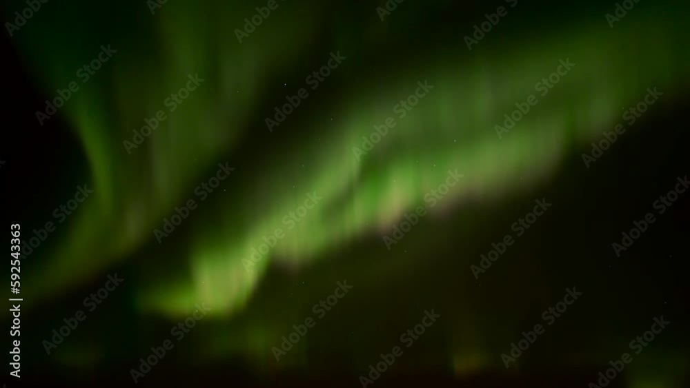 Realtime videos of the northern lights in green, pink and orange colours with a clear dark starry sky in the background Realtime videos of the northern lights in green, pink and orange colours with a clear dark starry sky in the background
