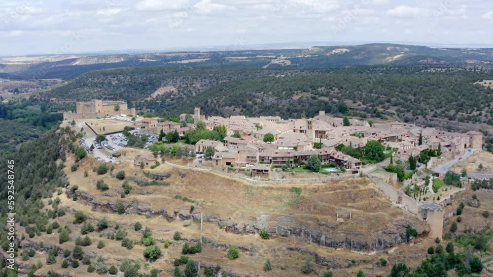 Aerial drone panning view around medieval town in the mountains of Spain. Aerial drone panning view around medieval town in the mountains of Spain.