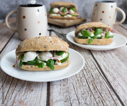 Sandwiches with mozzarella and ham. on a wooden background
