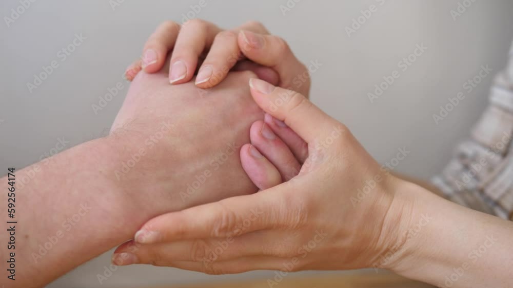Close-up of the hands of two people supporting each other. The concept of caring and supporting each other. Close-up of the hands of two people supporting each other. The concept of caring and supporting each other.