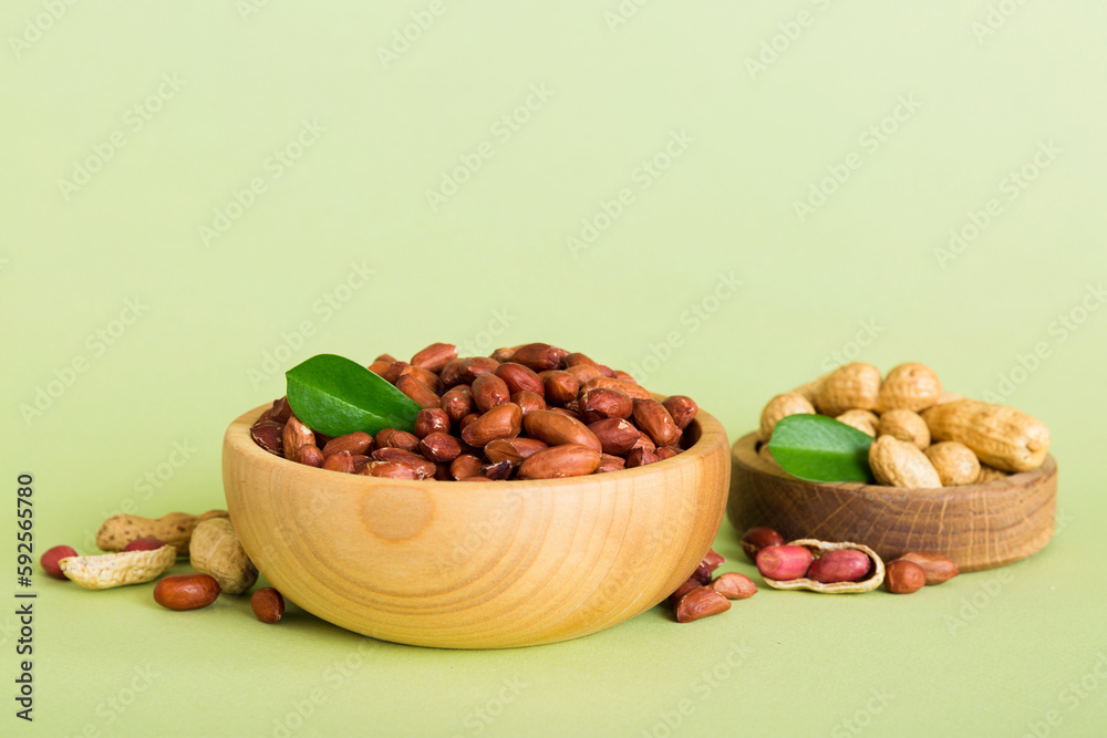 Fresh healthy peanuts in bowl on colored table background. Top view Healthy eating bertholletia concept. Super foods Fresh healthy peanuts in bowl on colored table background. Top view Healthy eating bertholletia concept. Super foods