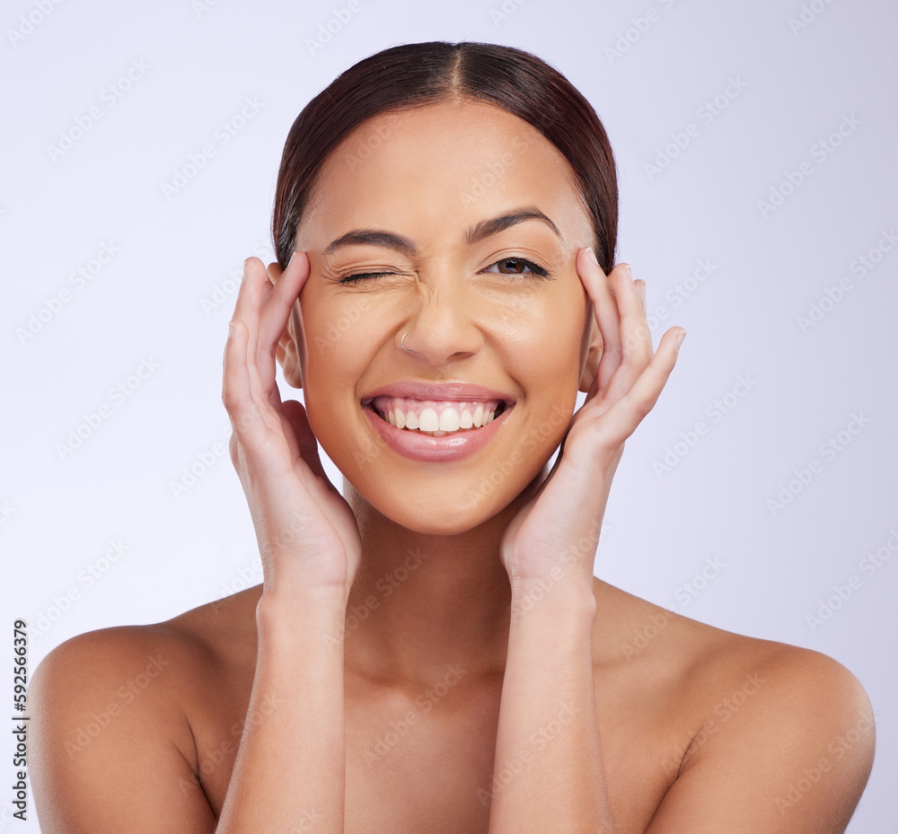 Woman portrait, beauty wink and skincare in a studio with happiness and smile from dermatology. Skin glow, facial and cosmetics of a young female model feeling happy from self care and face wellness
