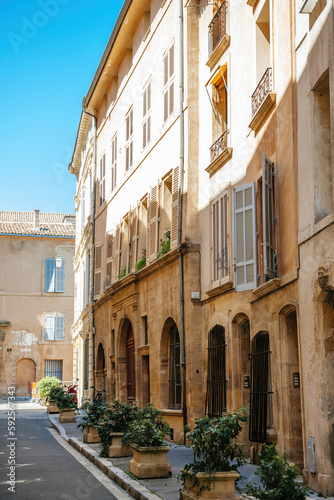 A vibrant street in Aix-en-Provence  France featuring an old church with a beautiful half-timbered facade and bustling shops. Perfect for a touristy journey