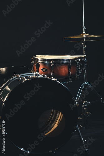 Drums on a dark background, part of a drum kit.