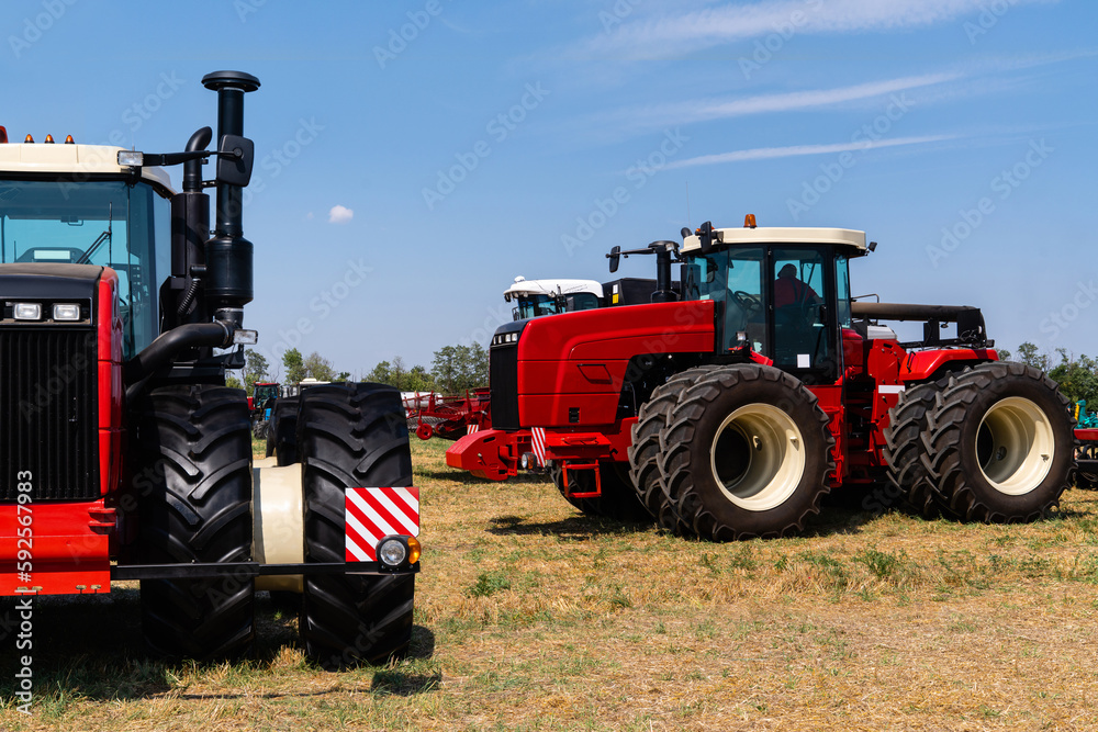 Obraz premium Agricultural tractors on a field