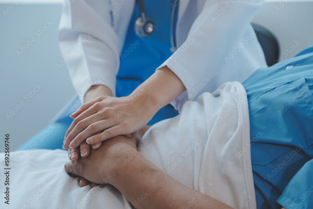 Injured patient showing doctor broken wrist and arm with bandage in hospital office or emergency room. Sprain, stress fracture or repetitive strain injury in hand. Nurse helping customer. First aid.