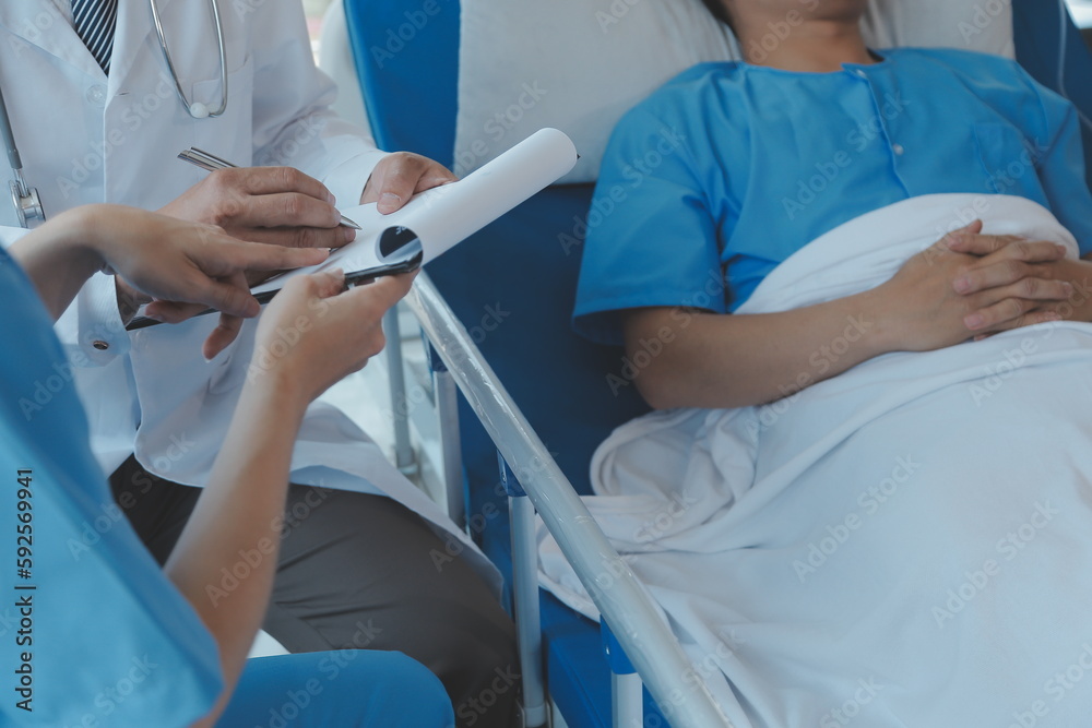 Injured patient showing doctor broken wrist and arm with bandage in hospital office or emergency room. Sprain, stress fracture or repetitive strain injury in hand. Nurse helping customer. First aid. Injured patient showing doctor broken wrist and arm with bandage in hospital office or emergency room. Sprain, stress fracture or repetitive strain injury in hand. Nurse helping customer. First aid.