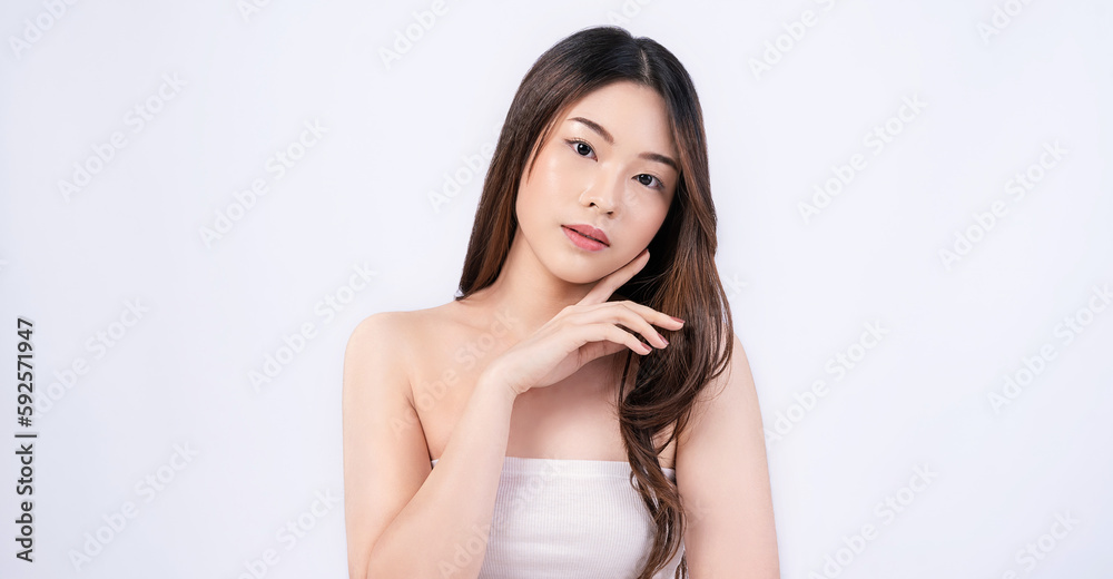 Closeup portrait of beauty asian woman with fair perfect healthy glow skin hand touching cheek isolated on white, young beautiful asia girl with pretty smile on face. Beauty korean spa skincare banner Closeup portrait of beauty asian woman with fair perfect healthy glow skin hand touching cheek isolated on white, young beautiful asia girl with pretty smile on face. Beauty korean spa skincare banner