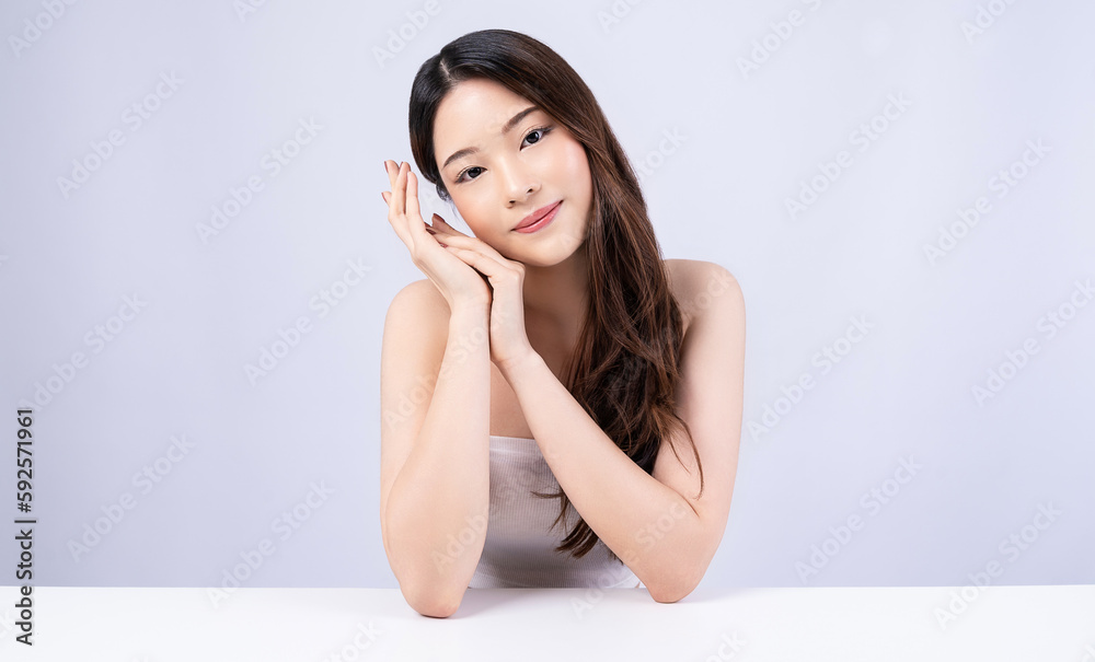 Closeup portrait of beauty asian woman with fair perfect healthy glow skin hand touching cheek isolated on white, young beautiful asia girl with pretty smile on face. Beauty korean spa skincare banner Closeup portrait of beauty asian woman with fair perfect healthy glow skin hand touching cheek isolated on white, young beautiful asia girl with pretty smile on face. Beauty korean spa skincare banner