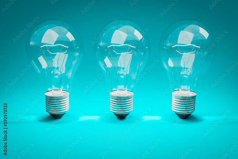 three retro style lightbulbs with glowing filament standing in a row on infinite colorful background; creativity design concept; 3D Illustration three retro style lightbulbs with glowing filament standing in a row on infinite colorful background; creativity design concept; 3D Illustration