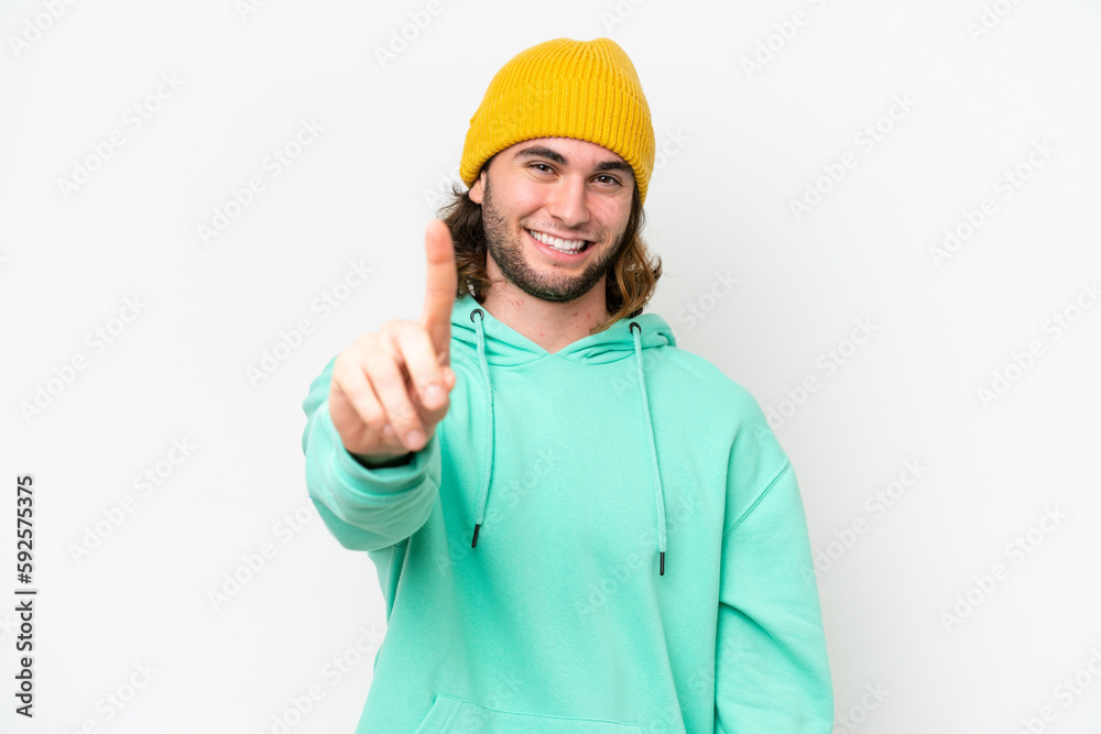 Young handsome man isolated on white chroma background showing and lifting a finger Young handsome man isolated on white chroma background showing and lifting a finger