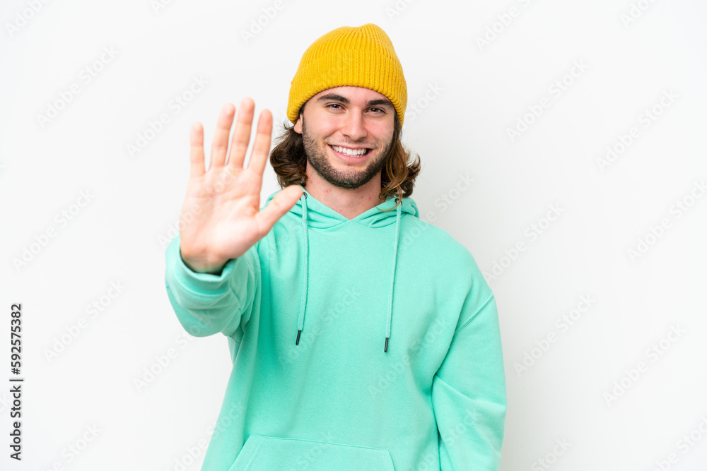 Young handsome man isolated on white chroma background counting five with fingers
