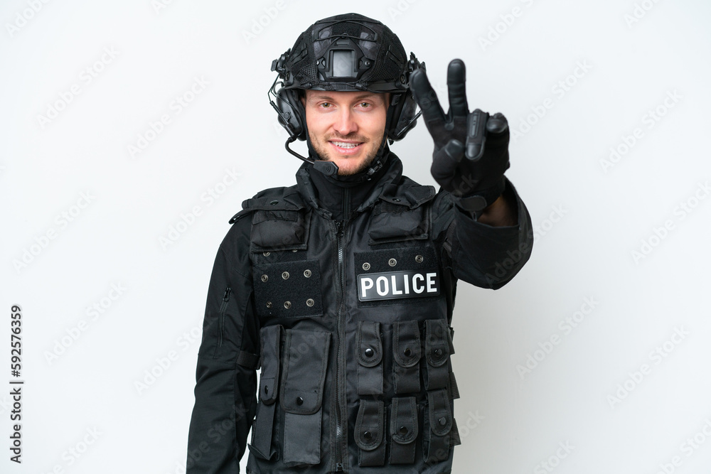 SWAT man over isolated white background smiling and showing victory sign SWAT man over isolated white background smiling and showing victory sign