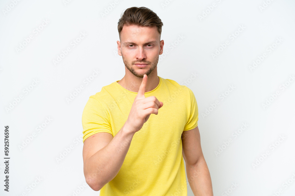 Young blonde caucasian man isolated on white background frustrated and pointing to the front Young blonde caucasian man isolated on white background frustrated and pointing to the front