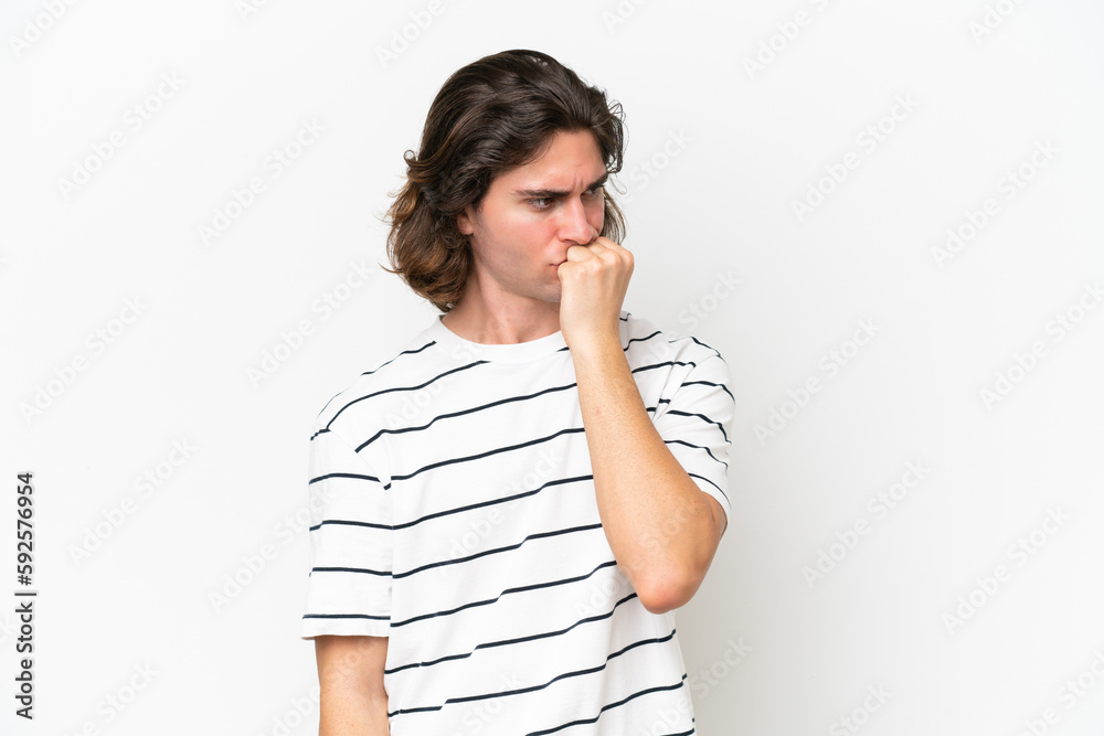 Young handsome man isolated on white background having doubts Young handsome man isolated on white background having doubts