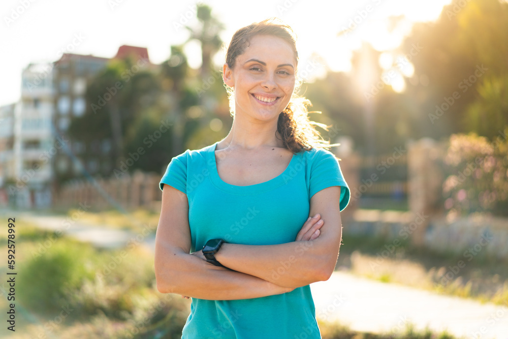 Young woman at outdoors doing sport Young woman at outdoors doing sport