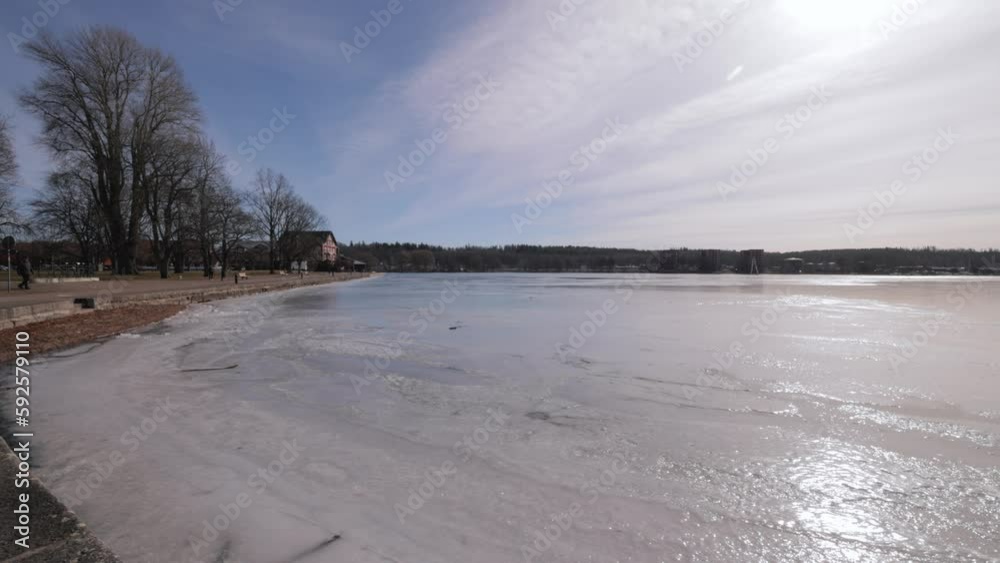 Panorama Of A Frozen Lake During Winter In Motala, Sweden. Wide Shot Panorama Of A Frozen Lake During Winter In Motala, Sweden. Wide Shot