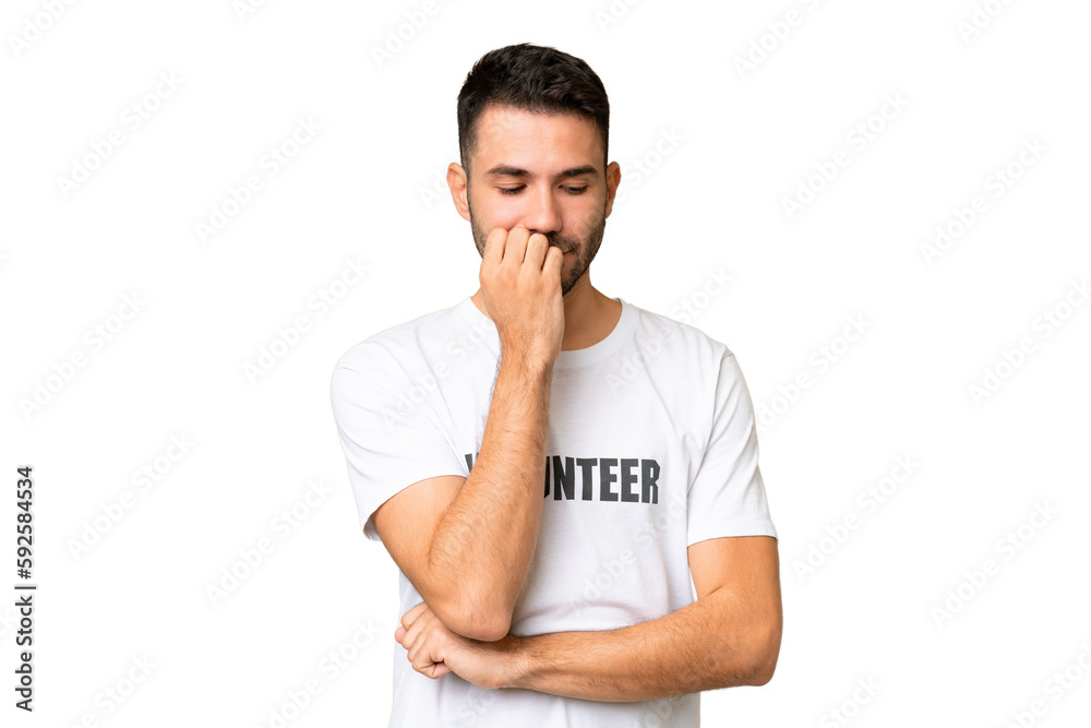 Young volunteer caucasian man over isolated chroma key background having doubts Young volunteer caucasian man over isolated chroma key background having doubts
