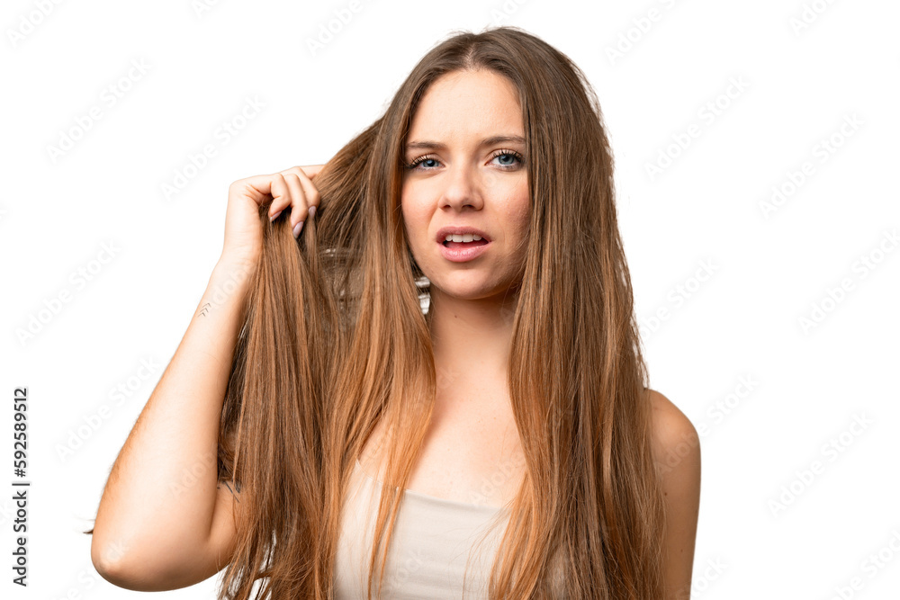 Young blonde woman over isolated chroma key background with tangled hair. Close up portrait