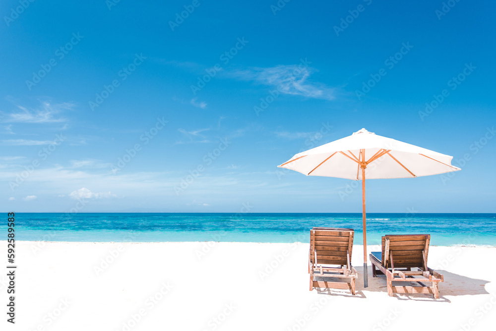 Chairs and umbrella on the tropical beach