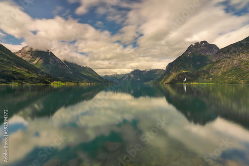 View of the beautiful Lake Lovatnet surrounded by mountains in Central Norway