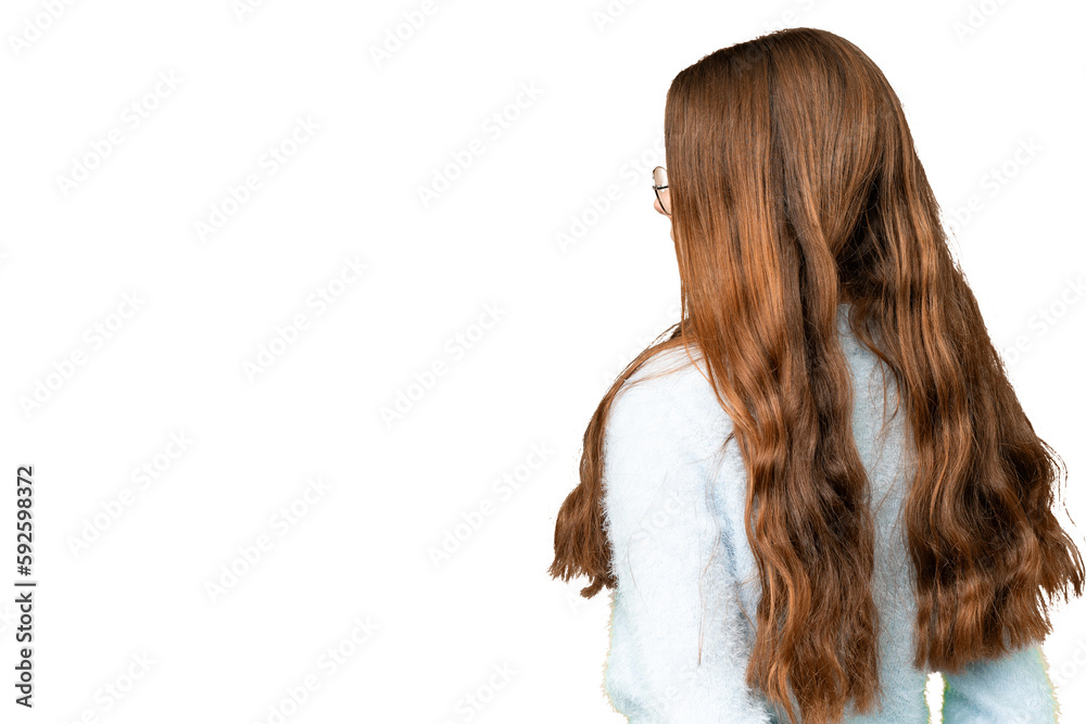 Teenager girl over isolated chroma key background in back position and looking back Teenager girl over isolated chroma key background in back position and looking back