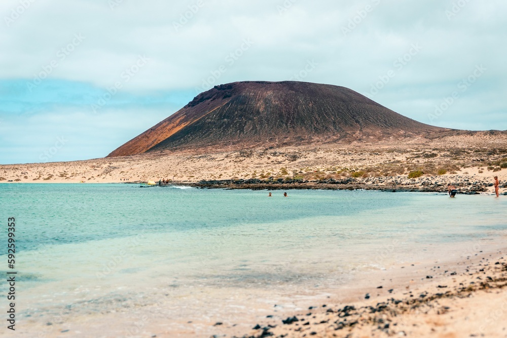 Beautiful ocean with the mountain in the background at the La Graciosa island Beautiful ocean with the mountain in the background at the La Graciosa island