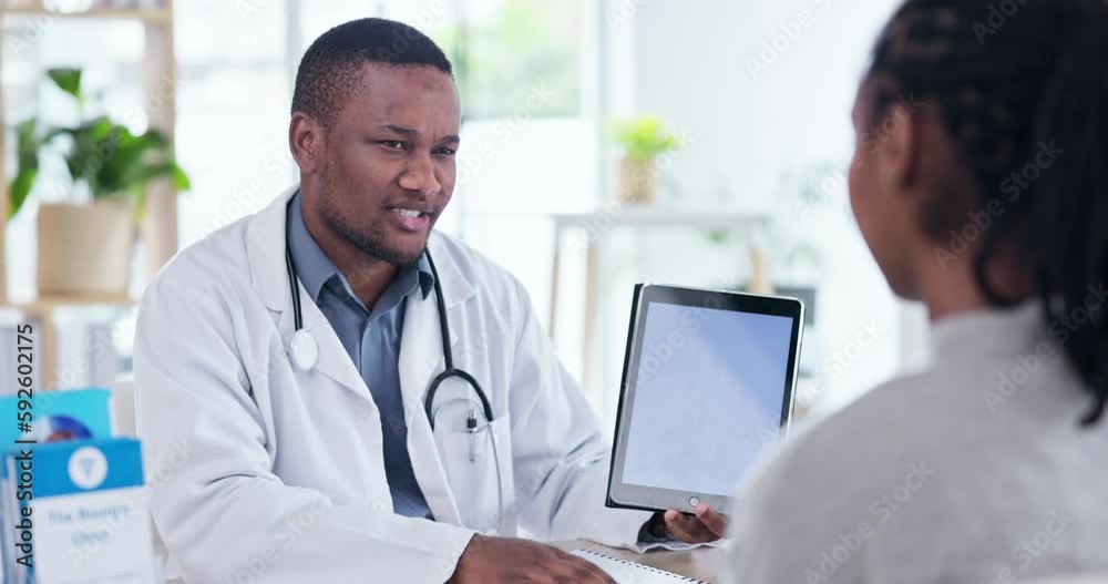 Consultation, tablet and doctor consulting a patient talking, discussion and in a hospital office for medicine. Medical, insurance and black man healthcare professional conversation for feedback