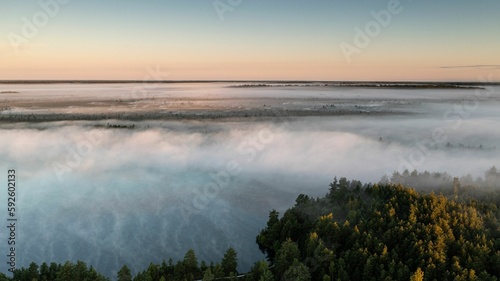 Drone shot of a lake with a little morning mist