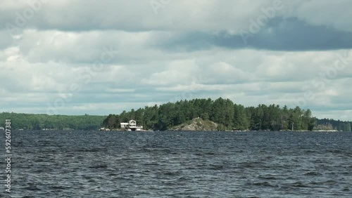 Footage of Muskoka Lake in Gravenhurst, Canada in cloudy sky background photo