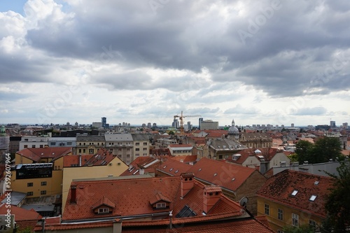 Aerial shot over the red buildings of Zagreb under the cloudy sky, Croatia