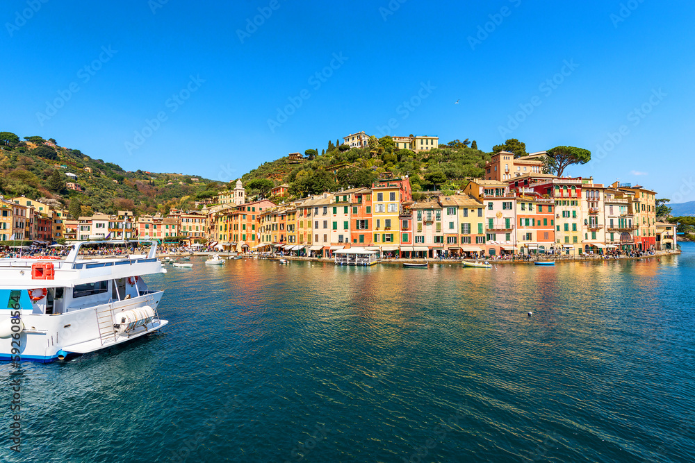 Famous village of Portofino, luxury tourist resort in Genoa Province, Liguria, Italy, Europe. Port and colorful houses, Mediterranean sea (Ligurian sea).