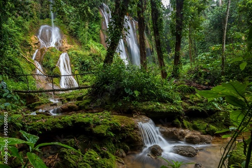 Landscape of cascading waterfalls in Gran Parque Natural Topes de Collantes park in Cuba photo