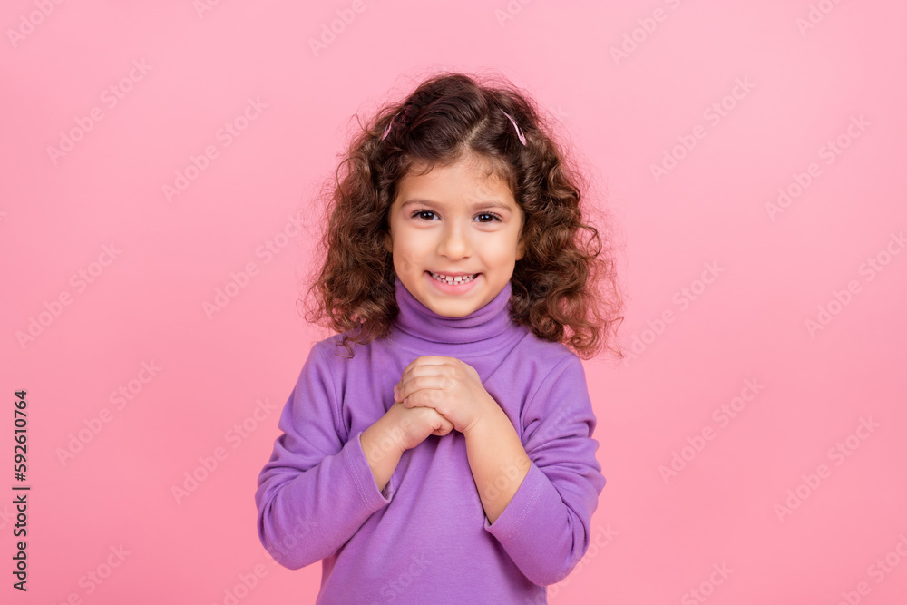 Photo of dreamy tricky small kid wear violet sweater smiling arms chest isolated pink color background Photo of dreamy tricky small kid wear violet sweater smiling arms chest isolated pink color background