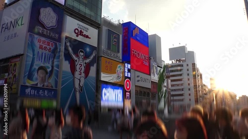 OSAKA, JAPAN : Time lapse shot of Dotonbori area, sunset to night. Tourist destinations, filled with neon signs, clubs and restaurants. All the logo and signs are blurred or overwritten for this video photo