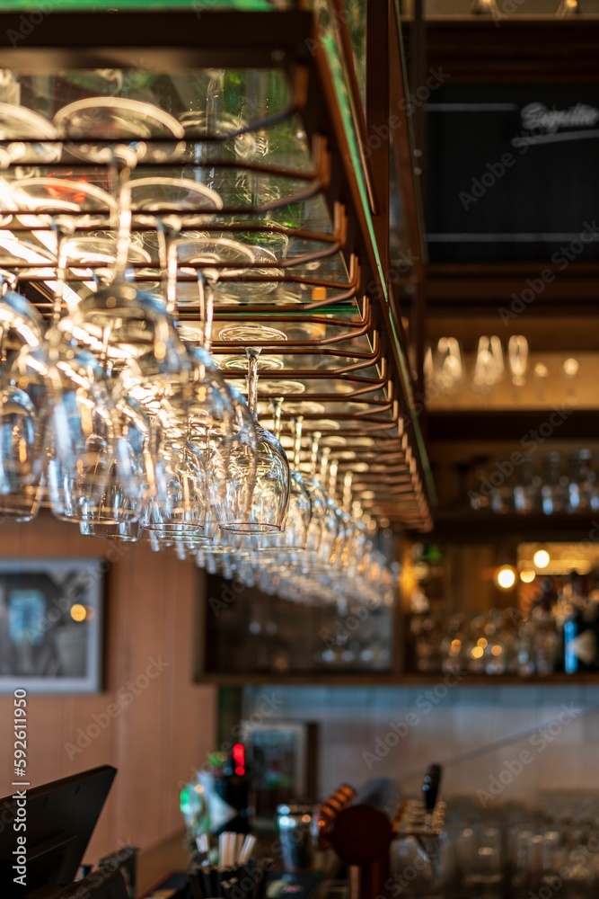 Closeup of hung glasses at the bar