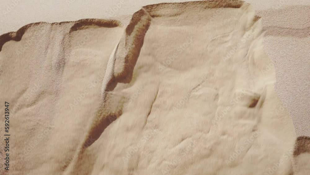 Closeup shot of sand mountain Collapsing