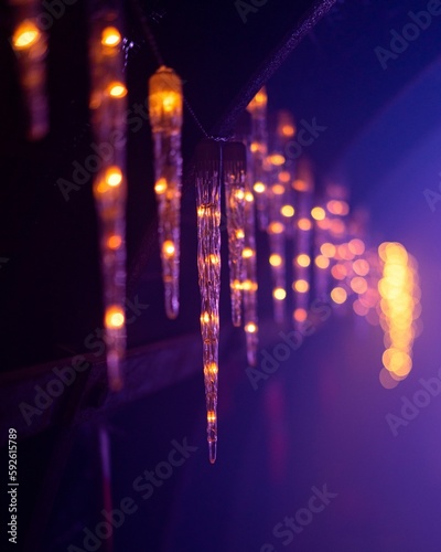 Vertical shot of beautiful Christmas lights hanging on the wall