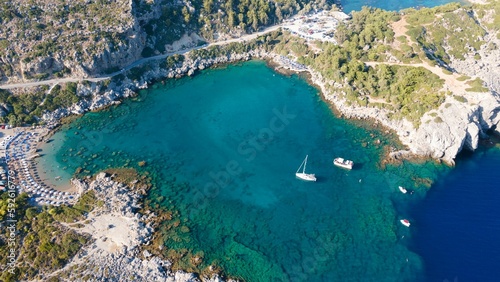 Aerial view of a boat sailing the blue ocean