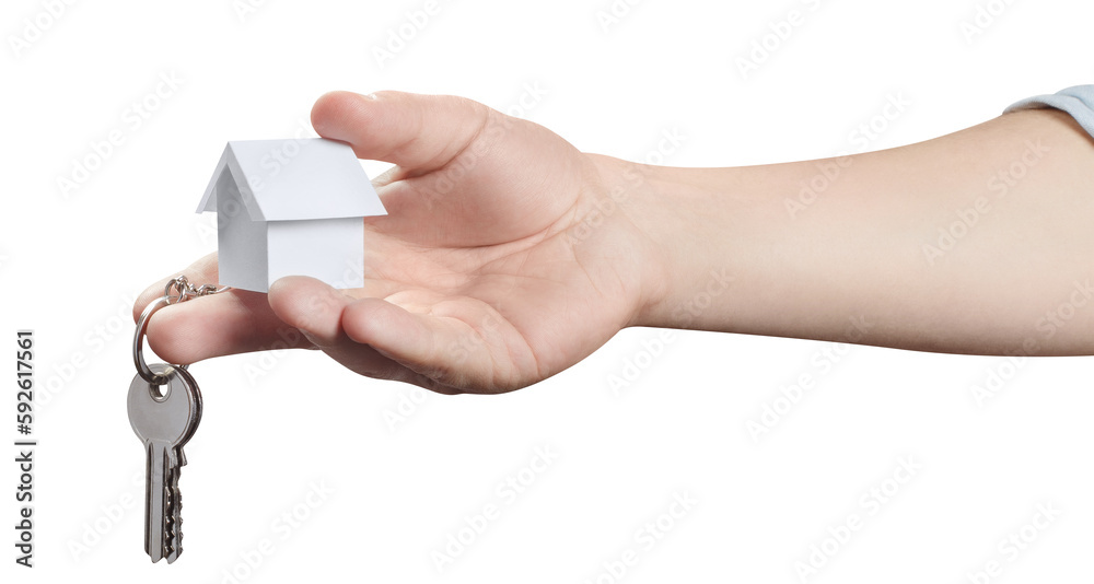 Hand holding keys and a small house, cut out Hand holding keys and a small house, cut out