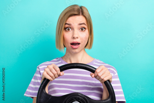 Closeup photo of young confused stressed girl speechless unbelievable how fast her car can ride isolated on aquamarine color background