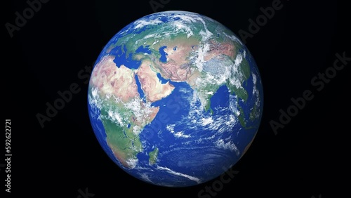 Seamless loop animation of rotating realistic planet Earth on a black background