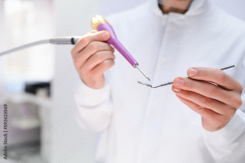 Young male dentist in clinic Young male dentist in clinic