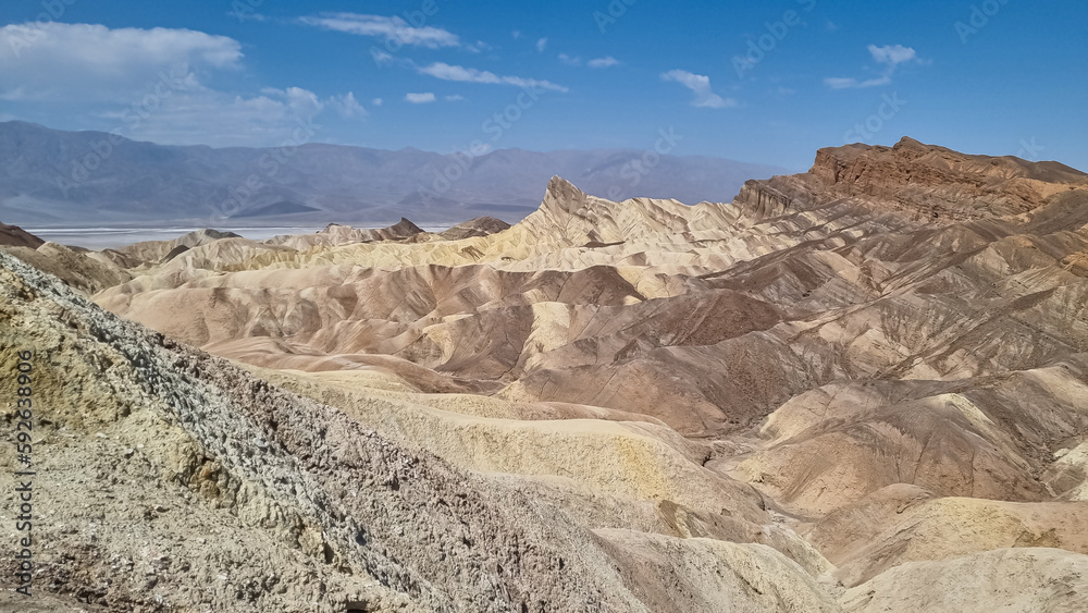 Scenic view of summit peak Manly Beacon seen from Zabriskie Point, Badlands, Furnace creek, Death Valley National Park, California, USA. Erosional landscape of multi hued Amargosa Chaos rock formation